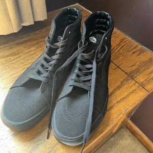Men’s size 12 high top all black Vans. Never worn.